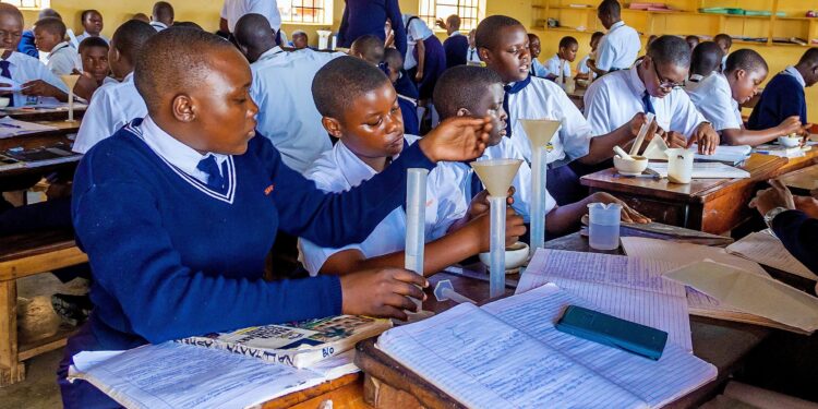 Students conduct a science practical lesson in a secondary school laboratory. File Photos.