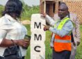 Christopher Mutumba, a law enforcement officer in Mukono Municipality’s Physical Planning Department, shows one of the boundary markstones installed during the municipal boundary-marking exercise.