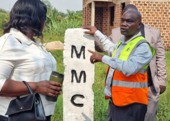 Christopher Mutumba, a law enforcement officer in Mukono Municipality’s Physical Planning Department, shows one of the boundary markstones installed during the municipal boundary-marking exercise.