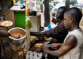 A food vendor operating close to a road or walkway.