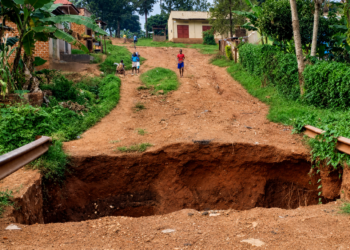 A section of a road in Njeru Municipality left severely damaged after a deep section of the road collapsed, disrupting access for residents.