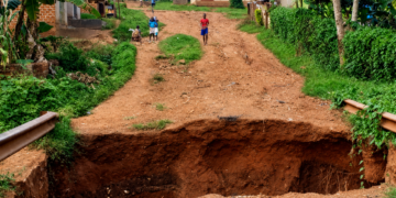A section of a road in Njeru Municipality left severely damaged after a deep section of the road collapsed, disrupting access for residents.