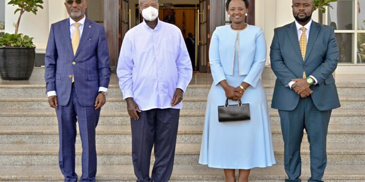 Ministers poses for a photo with President Yoweri Museveni after taking the oath of office at State House, Entebbe.