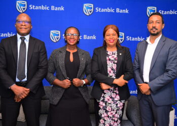 (L-R) Stanbic Bank's Ali Lwanga Head Sales, Syliva Atuhairwe Head Distribution, Yvonne Namutosi Manager Digital and E-Commerce and Dogo Singh Manager Insurance.JPG