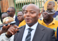 Kibuule addressing media after the court session. In circle is Kiwanuka.