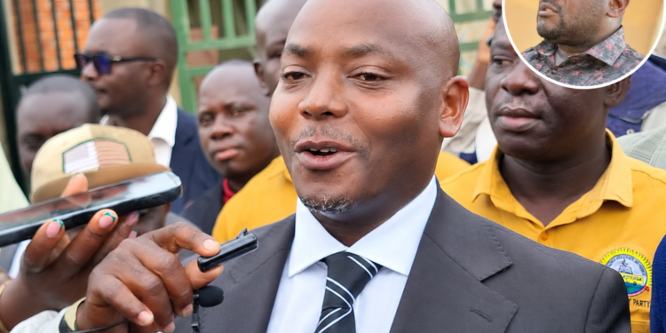 Kibuule addressing media after the court session. In circle is Kiwanuka.