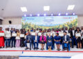 GreenTech graduates posing with their certificates after the graduation ceremony.