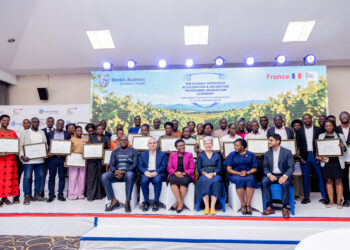 GreenTech graduates posing with their certificates after the graduation ceremony.