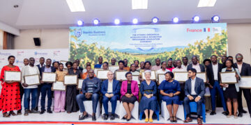 GreenTech graduates posing with their certificates after the graduation ceremony.