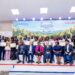 GreenTech graduates posing with their certificates after the graduation ceremony.