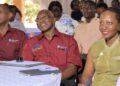 Prof. Aaron Mushengyezi, Prof. James Kiwanuka Tondo and Dr. Lillian Ssekabembe watch the film during the Olutindo research dissemination conference at Nkoyoyo Hall, Uganda Christian University (UCU).