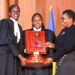 The winning UCU team receives the award from Minister for ICT and National Guidance Justine Kasule Lumumba after the final of the Unwanted Witness Privacy Moot Court Competition.
