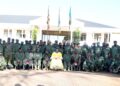 Minister for the Presidency Milly Babalanda poses for a photograph with senior military and civilian officers of Operation Wealth Creation (OWC) during a week-long capacity-building retreat at the National Leadership Institute (NALI) in Kyankwanzi.