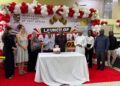 International University of East Africa Vice Chancellor Prof. Emeka Akaezuwa joins students in cutting a cake during the launch of the university’s January 2027 intake at its Kansanga campus in Kampala.
