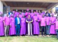 A team of clergy pose for a group photo with Minister for the Presidency Milly Babalanda during the 141st commemoration of Bishop James Hannington in Mayuge District.
