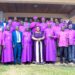 A team of clergy pose for a group photo with Minister for the Presidency Milly Babalanda during the 141st commemoration of Bishop James Hannington in Mayuge District.