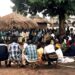 Community gathering Illustrates residents gathering to demand justice.