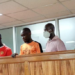 Ibrah Muwonge (centre) with his co-accused during an earlier court appearance in the case involving the destruction of electricity infrastructure.